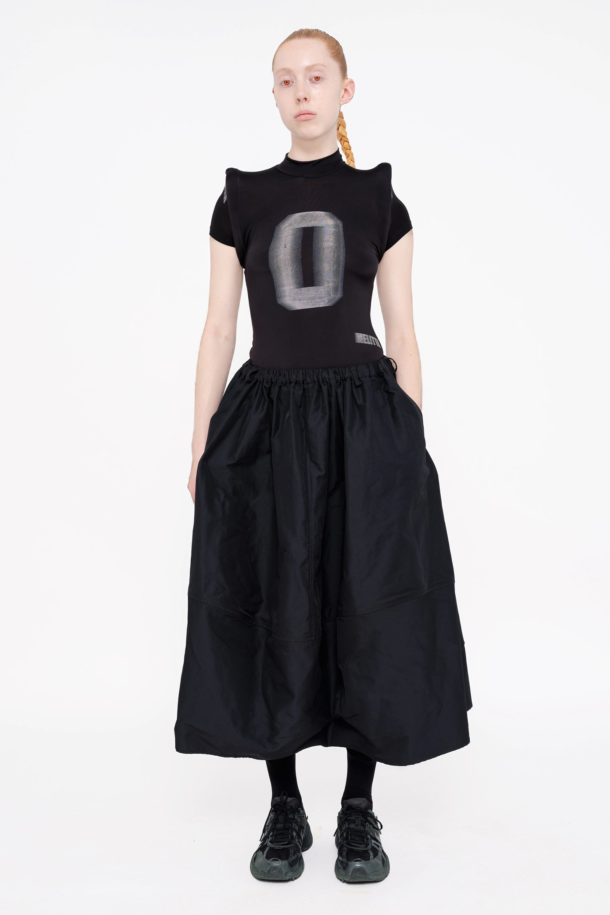 female-wearing-black-spongy-shoulder-top-and-black-maxi-volume-skirt-on-white-background-full-body-front